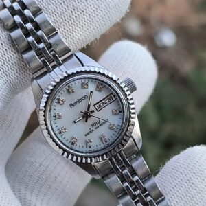 Armitron quartz ladies watch stone studded dial president model